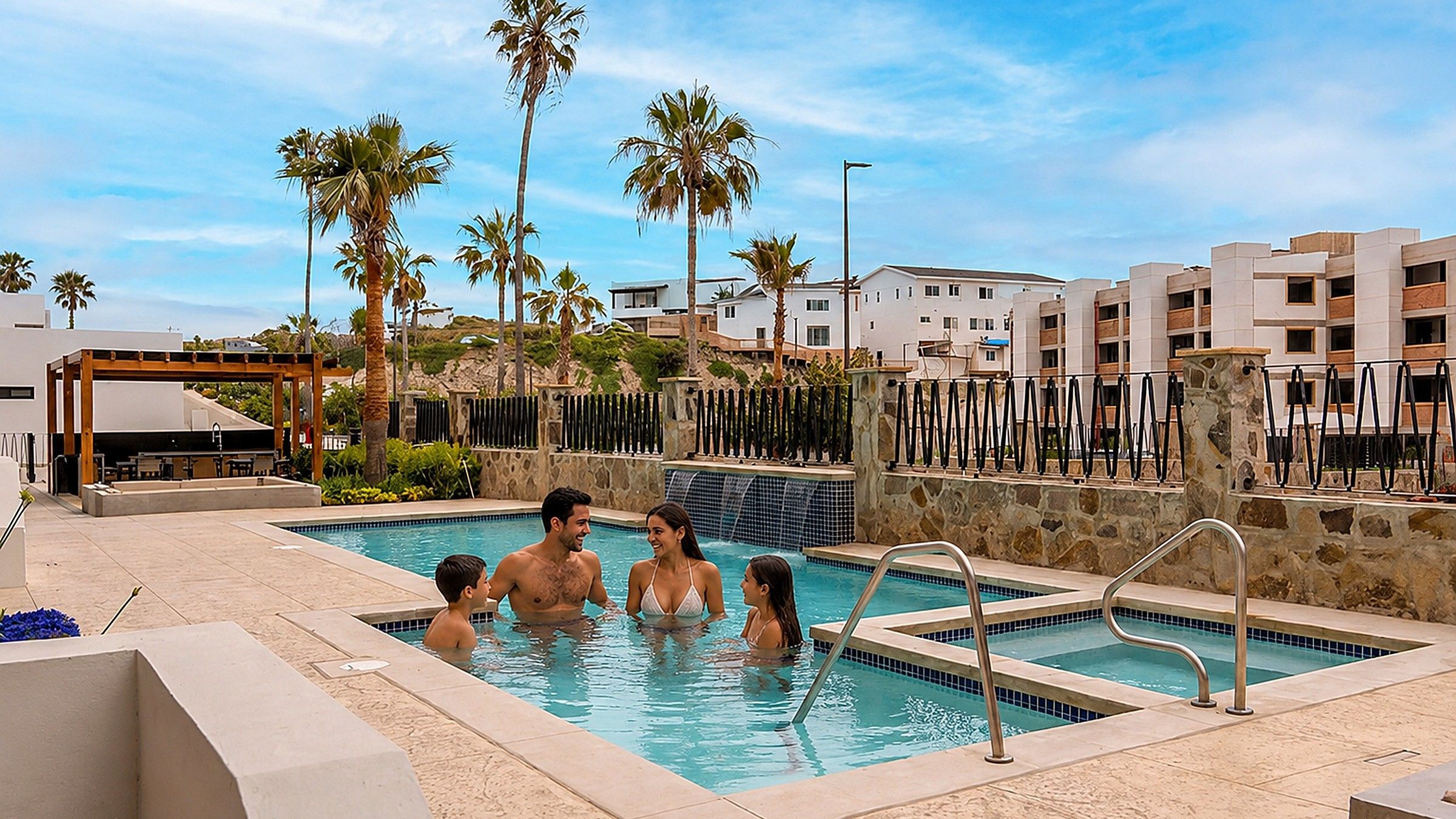 Family enjoying the resort pool and jacuzzi
