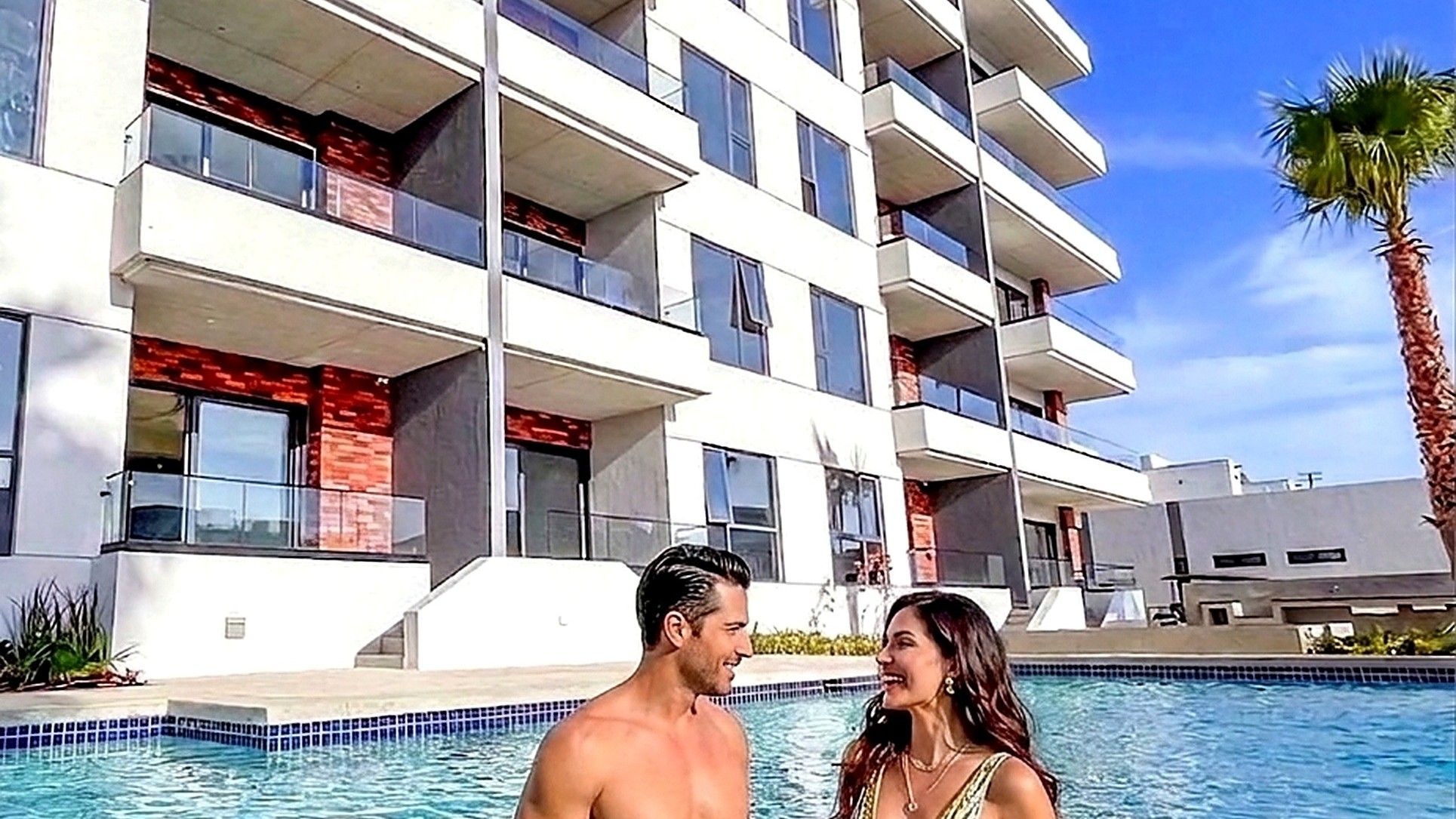 Couple relaxing poolside